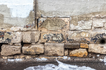 Old stone blocks of the basement of an old house