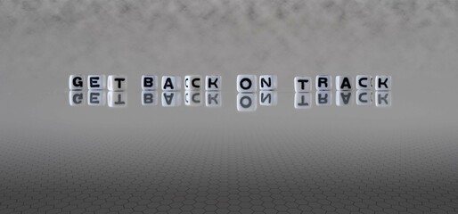 get back on track word or concept represented by black and white letter cubes on a grey horizon background stretching to infinity