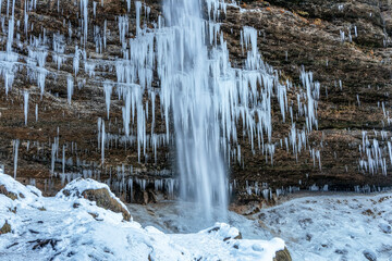 Beautiful Pericnik waterfall in Slovenia in wintertime