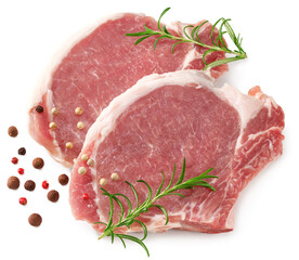 sliced raw pork meat with rosemar and peppercorn isolated on white background. Clipping path and...