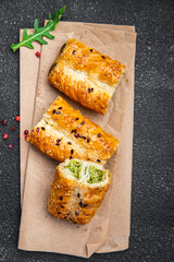 rollini savory pastries spinach, cheese puff pastry fresh phyllo dough healthy meal takeaway food snack on the table copy space food background 