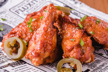 Delicious barbecue chicken wings served and ready to eat. Food concept.