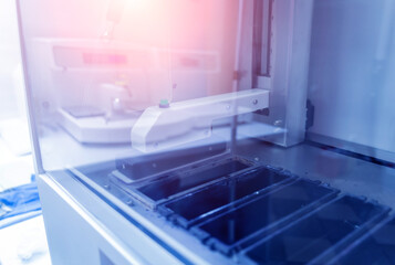 Obraz premium Automatic multi slides stainer at the modern laboratory