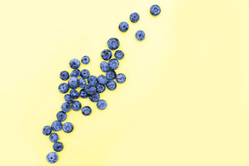 Blueberries. Blueberry isolate on yellow. Top view.