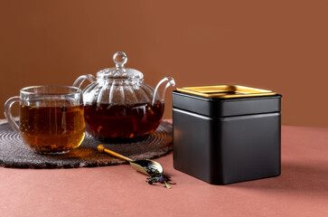 Black metal packaging for tea. Tea branding and packaging mockup. Blank tea packaging mockup with...