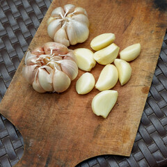 garlic. garlic cloves. peel the garlic clove. Garlic is one of the main spices in Indonesian cuisine