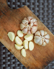 garlic. garlic cloves. peel the garlic clove. Garlic is one of the main spices in Indonesian cuisine