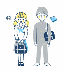 困った表情の中学生の男女