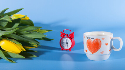 Flowers, coffee and red clocks. Romance on Valentine's Day