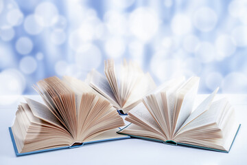 Abstract unfocused background - three open books and a bokeh.