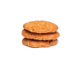 Oat vanilla sugar cookies isolated on white background. Close-up view of brown yellow snacks. Macro shot of beige biscuit cakes for your design