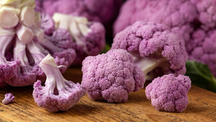 Purple colourful cauliflower on wooden rustic board. - Powered by Adobe