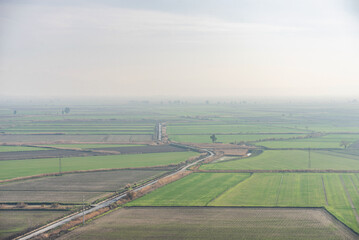 Aerial view of endless lush pastures and farmlands of Turkey. Beautiful Turkey countryside with emerald green fields and meadows. Rural landscape on sunset.