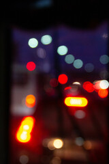Blurred car lights of cars standing in traffic.