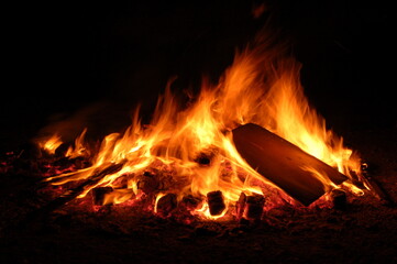 Bonfire with burning boards, large, at night in the dark. For Lag Omer