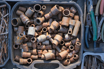 old circles on the saw. old drills close-up showing old rusty metal and brass parts in bulk for decoration or collection, sold at flea market or garage for antique collection. Rusty keys and tools 