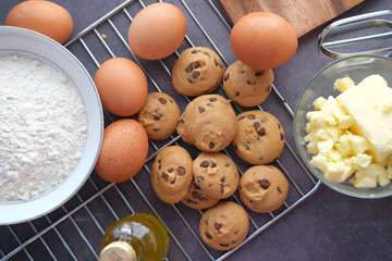 Baking ingredients on a black background, top view.