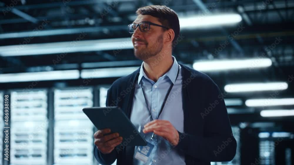 Fototapete Male IT Specialist Walks Between Row of Operational Server Racks in Data Center. Engineer Uses Tablet Computer for Maintenance and Diagnostics in Cyber Security and Data Protection Facility.