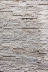 textured stone on the wall. smoothly laid out in a row with a bright texture. wall decoration
