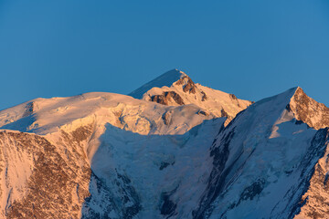 The Mont Blanc massif and its snow-capped peaks in Europe, France, Rhone Alpes, Savoie, Alps, in winter, on a sunny day.