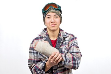 Teenager shows wrapped splint on wrist.