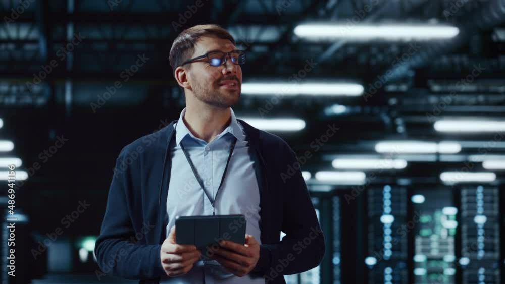 Fototapete Handsome Data Center IT Specialist Using Tablet Computer. Server Farm Cloud Computing Facility with System Administrator Working. Data Protection Engineering Network for Cyber Security.
