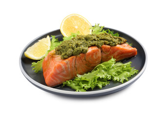 Delicious cooked salmon with pesto sauce, lettuce and lemon on white background