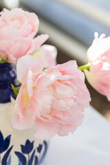 Delicate pink fresh tulips in the vase background