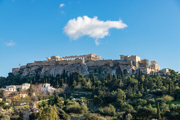 Fototapeta premium Panorama of the Acropolis. Ancient Greek Parthenon on Acropolis hill is a top landmark of Athens. Scenery of the famous monuments in the Athens center in summer. Landscape with ruins