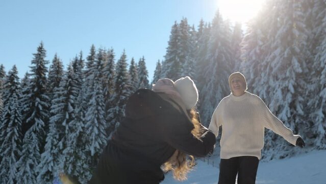 Friends Having Fun on a Sunny Winter Day, Taking Photos with a Smartphone, Laughing and Jumping, Enjoying Time in a Snowy Forest, Portrait, 4k, Copy Space