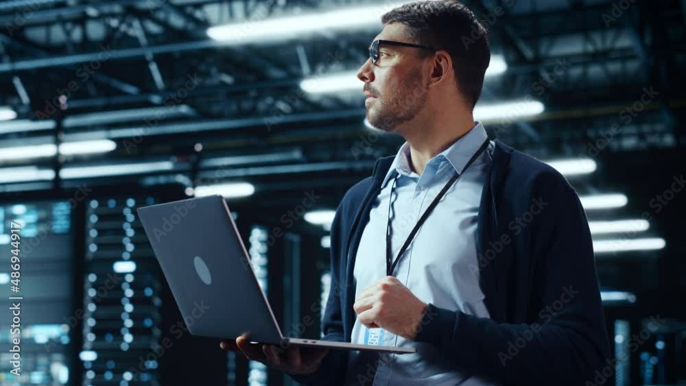 Poster Successful Data Center IT Specialist Using Laptop Computer. Server Farm Cloud Computing Facility with System Administrator Working. Data Protection Engineering Network for Cyber Security.