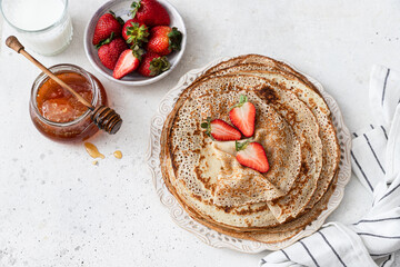 Stack of traditional russian pancakes blini on wooden background. Maslenitsa traditional Russian...