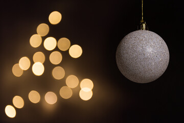 White christmas ball with defocused lights background