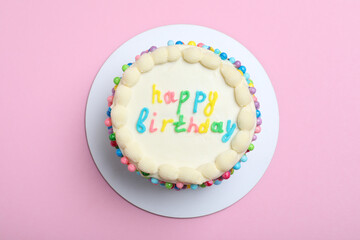 Cute bento cake with tasty cream on pink background, top view