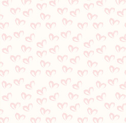 Seamless pattern of hand drawn hearts in pastel red color on beige and neutral background