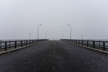 Wide bridge with railings and street lamps. Bridge to nowhere. Perspective into the distance (1144)