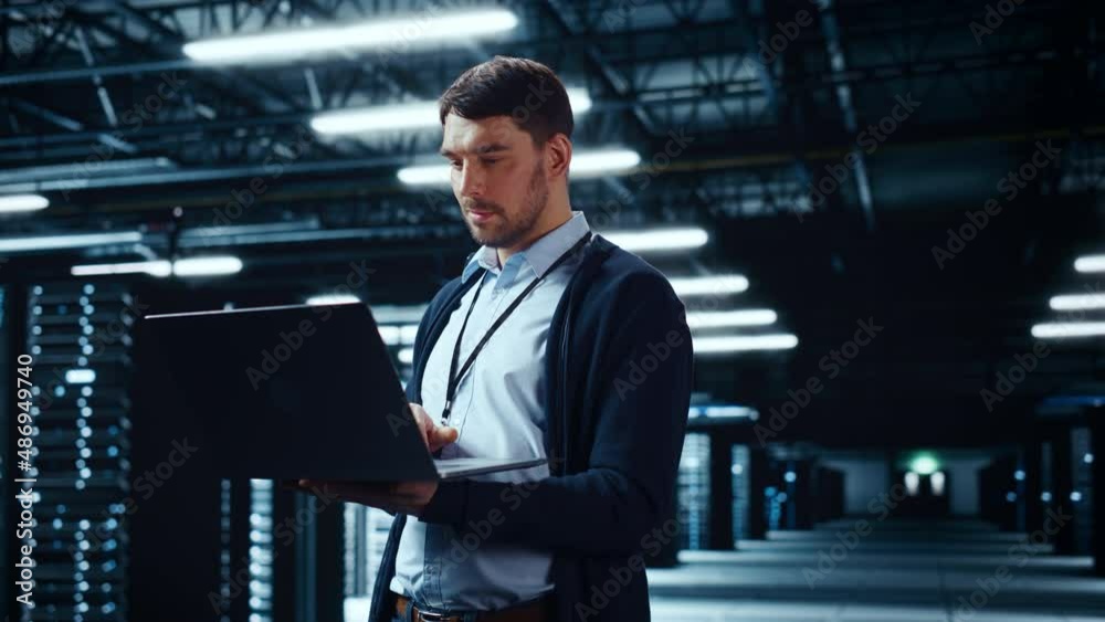 Leinwandbilder Successful Data Center IT Specialist Using Laptop Computer. Server Farm Cloud Computing Facility with System Administrator Working. Data Protection Engineering Network for Cyber Security.