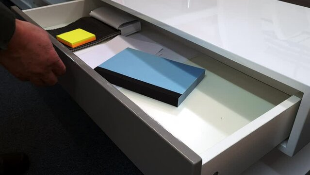 A cabinet fitted with sprung loaded drawer system for easy, smooth operation.