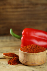 Paprika and sweet bell pepper on wooden table