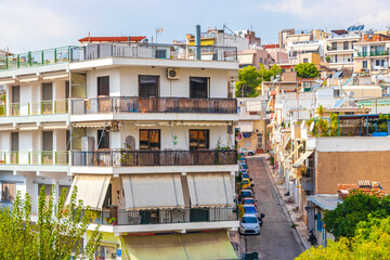 Fototapeta na wymiar Typical street road buildings cars in Greeces capital Athens Greece.