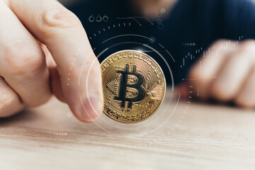 A person holds an abstract cryptocurrency coin. Concept of virtual money