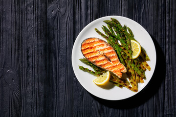 grilled salmon steak with asparagus and lemon