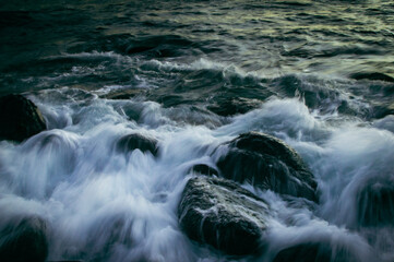 Fototapeta premium water flowing over rocks