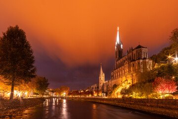 LOURDES, FRANCE - OCTOBER 10 2021: Notre Dame du Rosaire de Lourdes at night