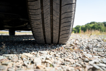 Tires of a standing car on stony ground