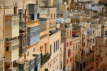 Fototapeta na wymiar Valetta, Malta - December 19, 2021Vintage view of typical buildings balconies in La Valletta