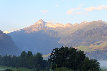 Obraz premium Panorama view with alpine mountains and blue sky in Salzburgerland, Austria