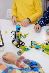 Students In School Computer Coding Class Building And Learning To Program Robot Vehicle. Multi...