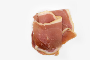 Jamon slice isolated on white background