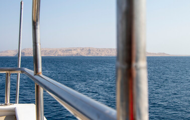 View of the lonely island in the Red sea from a diving boat